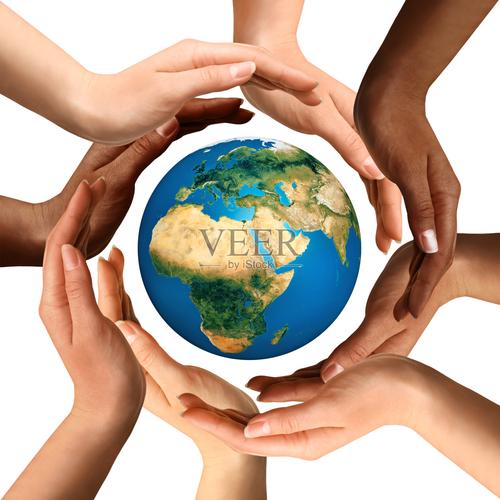 Diverse hands surrounding a globe