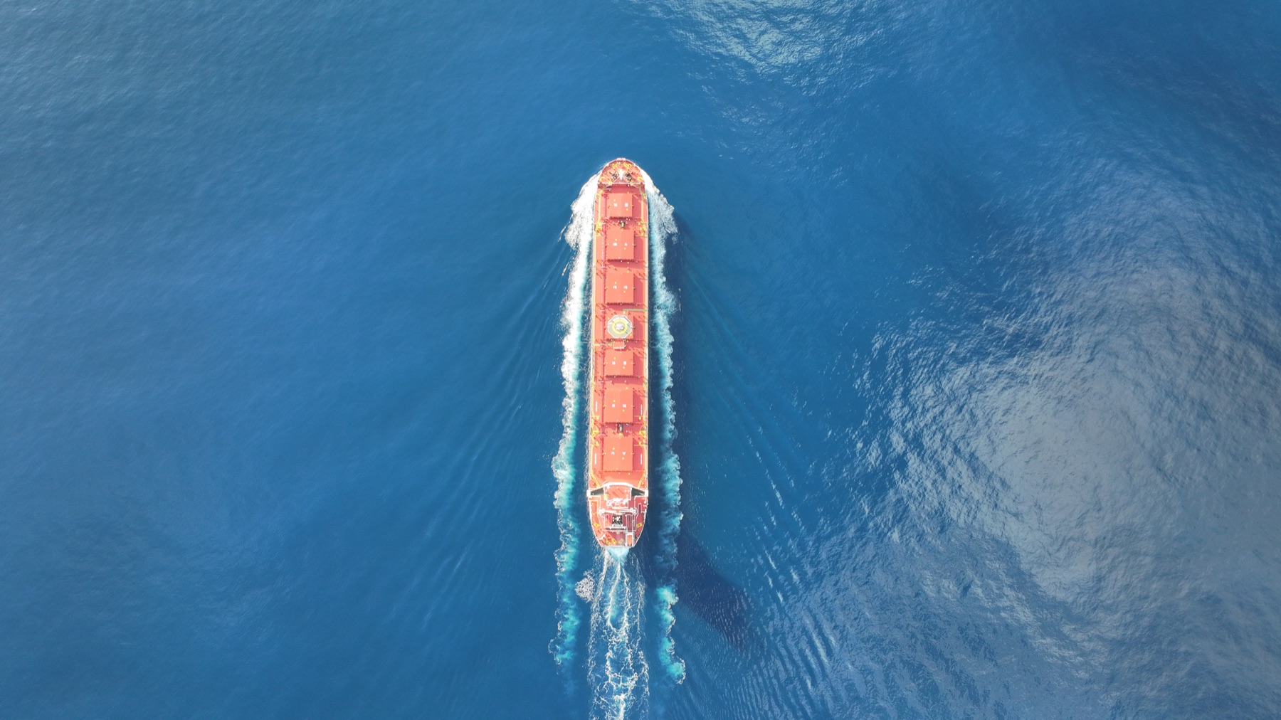 Cargo ship crossing open ocean